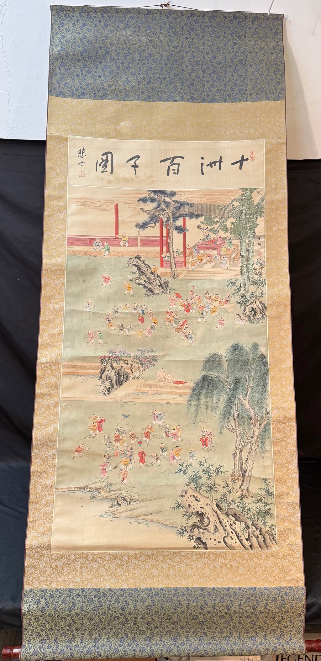 CHINESE ONE HUNDRED BOYS HANGING SCROLL ON SILK, 20TH CENTURY WITH BOX, 30IN x 78IN (76cm x 198cm)